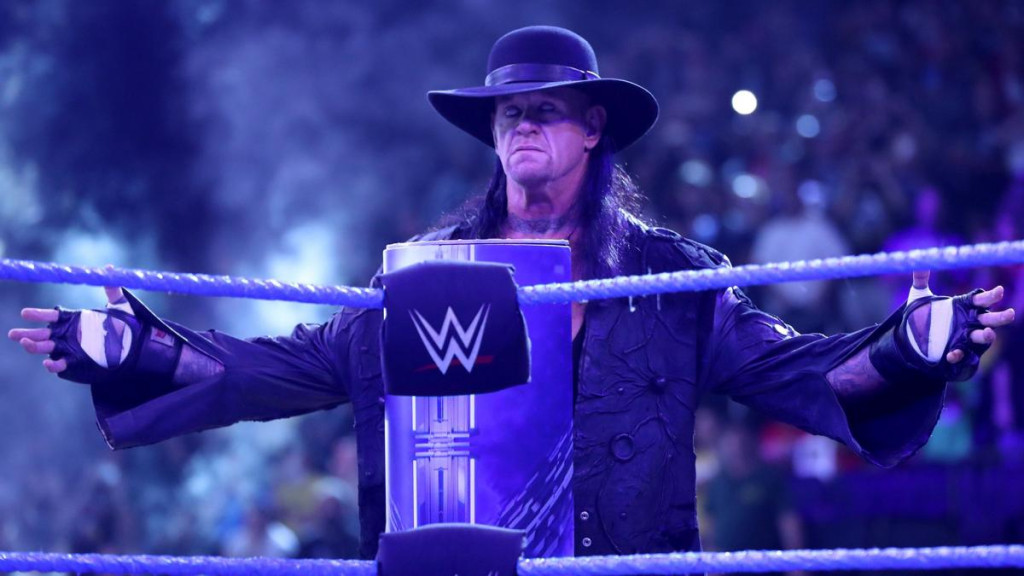 The Undertaker enters the ring